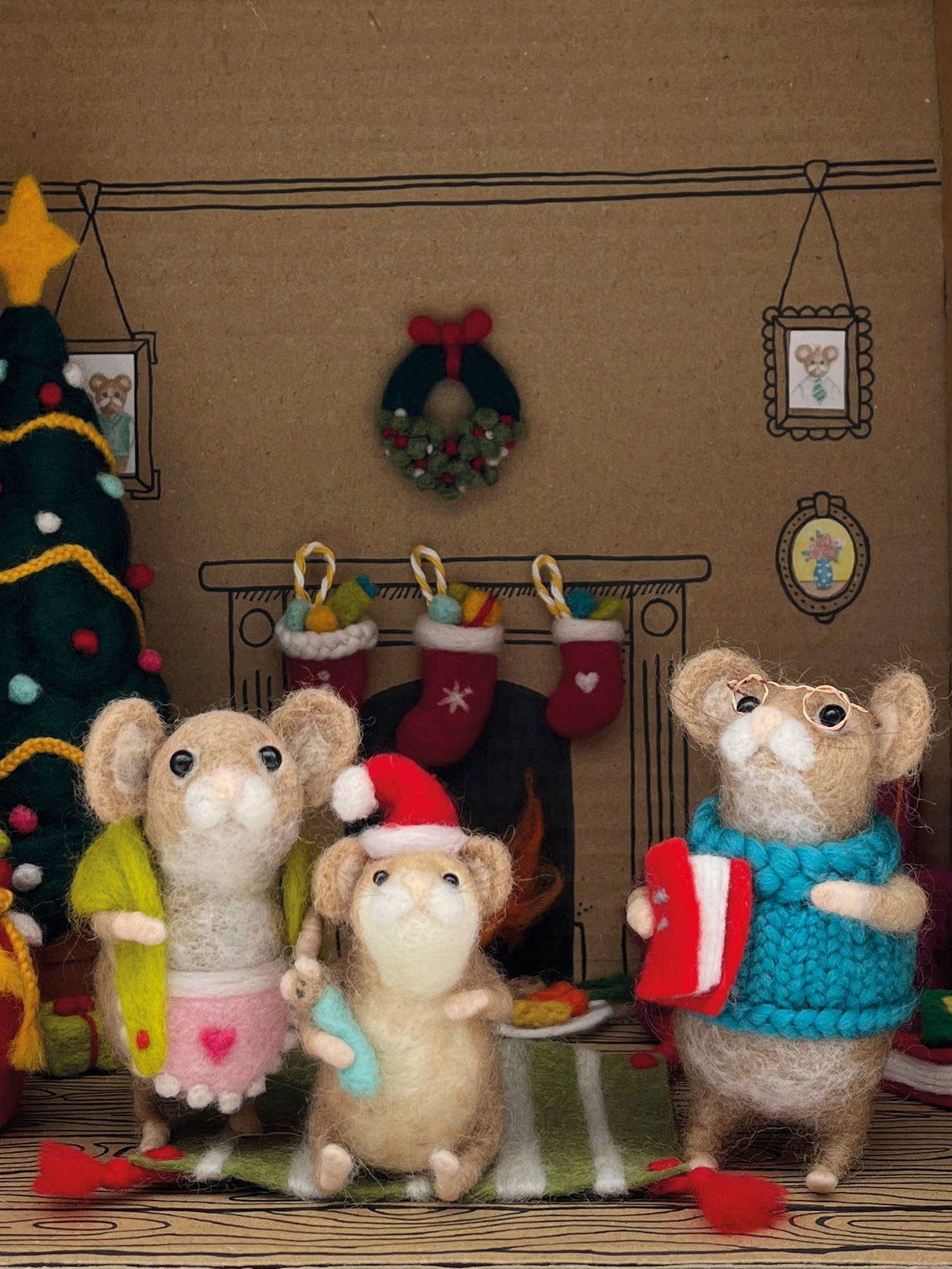 Create three charming felt mice with the Bergin & Bath Deluxe Christmas Mouse Advent Calendar Needle Felting Kit. The kit makes a cozy holiday scene, complete with mice, tree, stockings, wreath, and advent calendar.